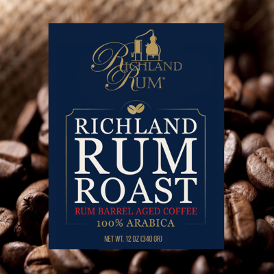 Richland Rum Roast coffee package with coffee beans in the background